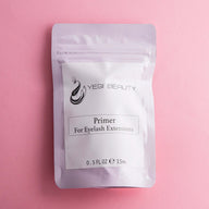 Light pink pouch against pink background. White label with black lettering reads "Yegi Beauty Primer For Eyelash Extensions"