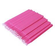 Stack of pink micro brushes for eyelash extension application