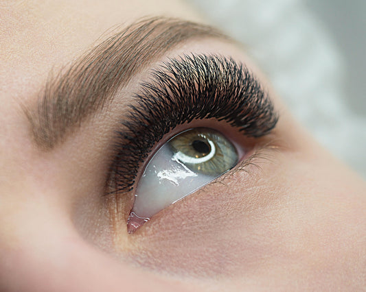 Closeup of a woman's eye with lash extensions