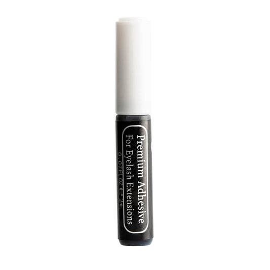 2ml bottle black in color with silver cap premium adhesive for eyelash extensions against white background