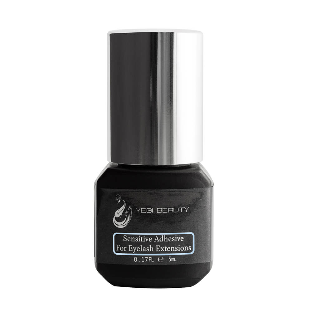 Black 5ml bottle with silver cap. Label reads "Yegi Beauty Sensitive Adhesive For Eyelash Extensions" with a light blue rectangle around the words. Bottle against white background.