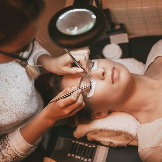 Woman Applying Eyelashes