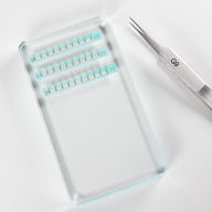 Glass eyelash holder with extensions and tweezer 