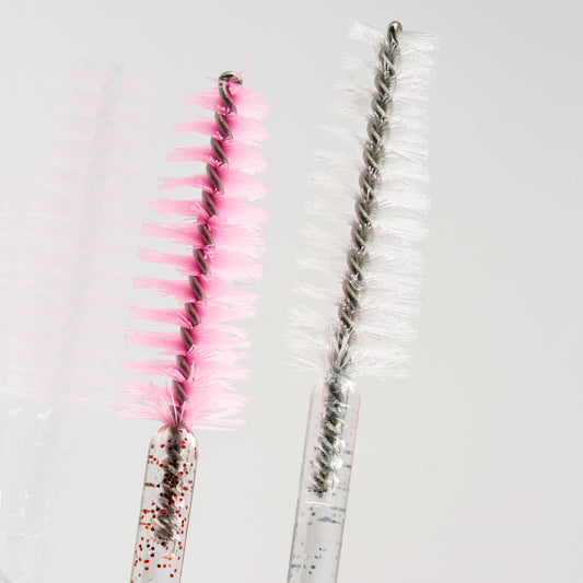 closeup of brushes for eyelash extension care.