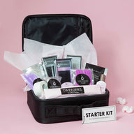 Eyelash Extension Starter Kit with tweezers glue rings brushes and classic extensions primer tape glue rings and adhesives all in a small carrying case.
