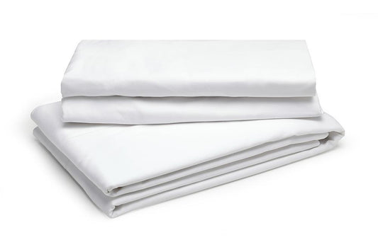 folded white lash bed sheets
